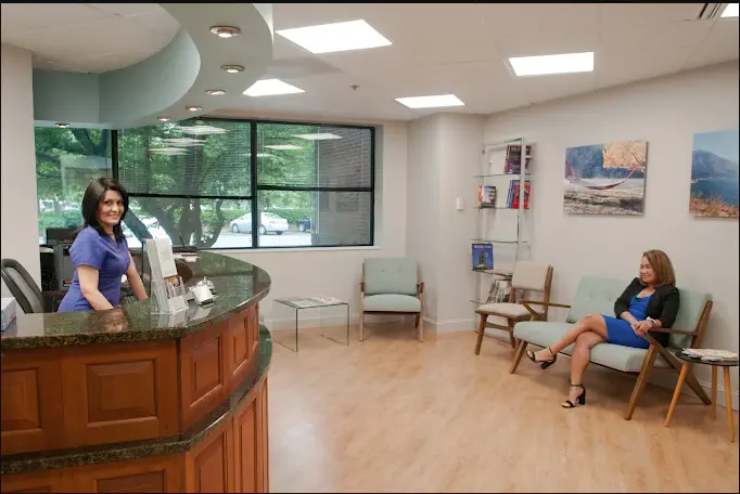 Fairfax Advanced Dentistry reception area with front desk and waiting room